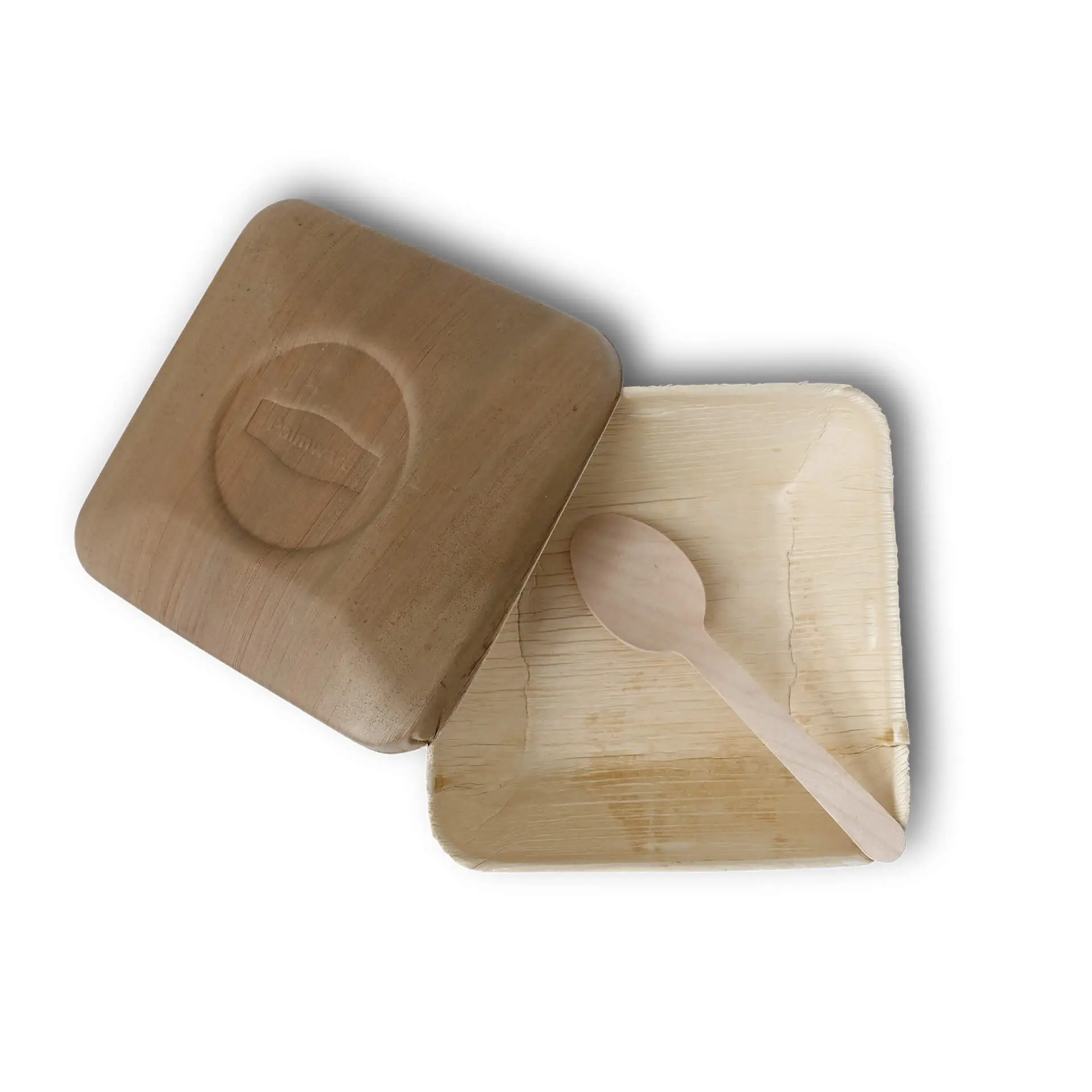 Una ciotola di foglia di palma con un coperchio e un cucchiaio di legno all'interno, adatta per cibi caldi e grassi, ecologica e biodegradabile.