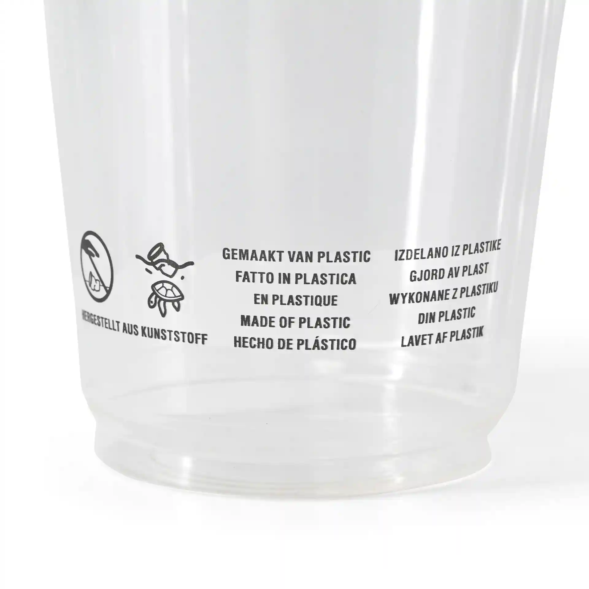 Bicchiere di plastica trasparente con testo multilingue stampato su materiale e istruzioni per l'uso.