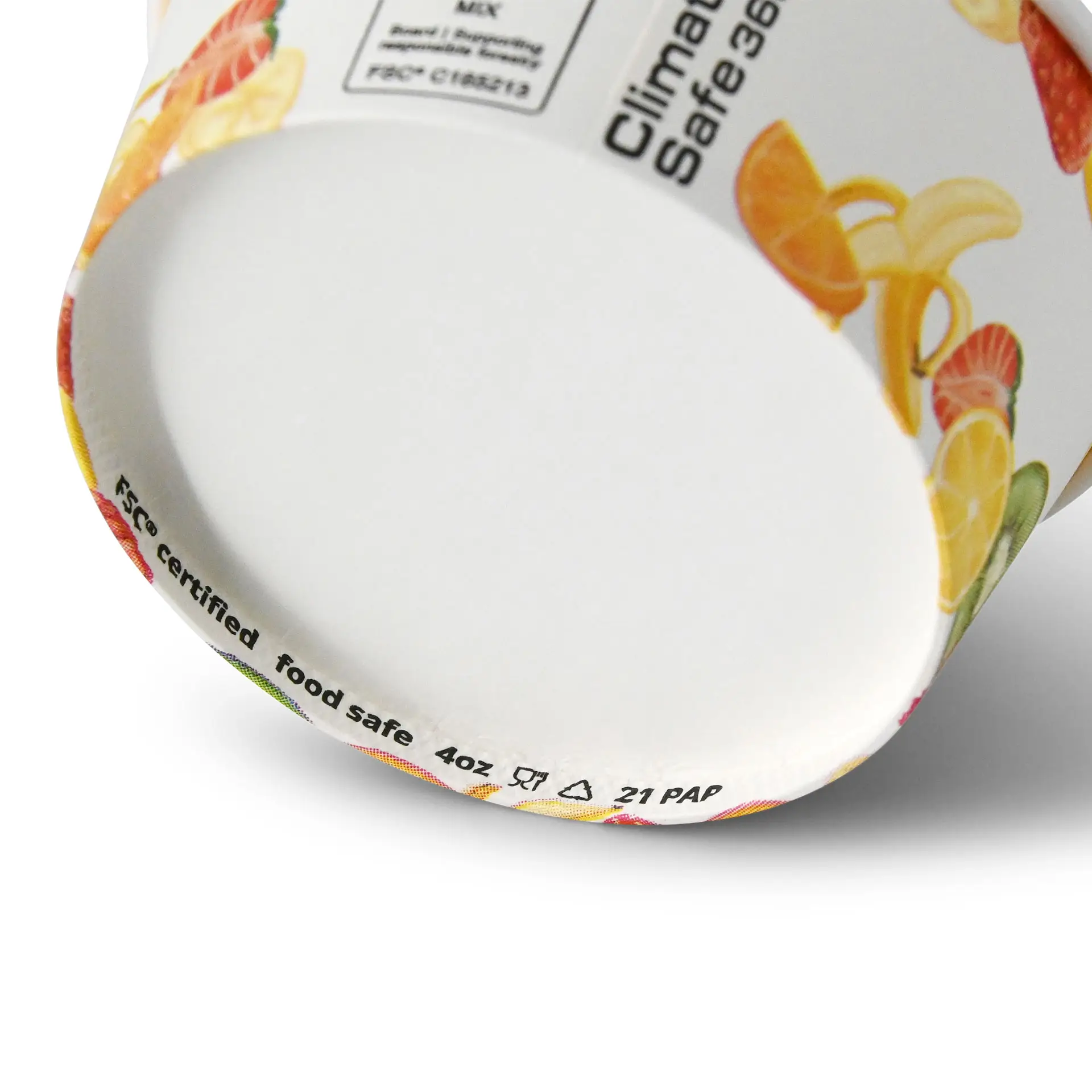 Una coppa per gelato in carta da 4 oz rivestita in PE stampata con frutta; mostra dettagli interiori e di base, inclusi i marcatori di sicurezza alimentare.