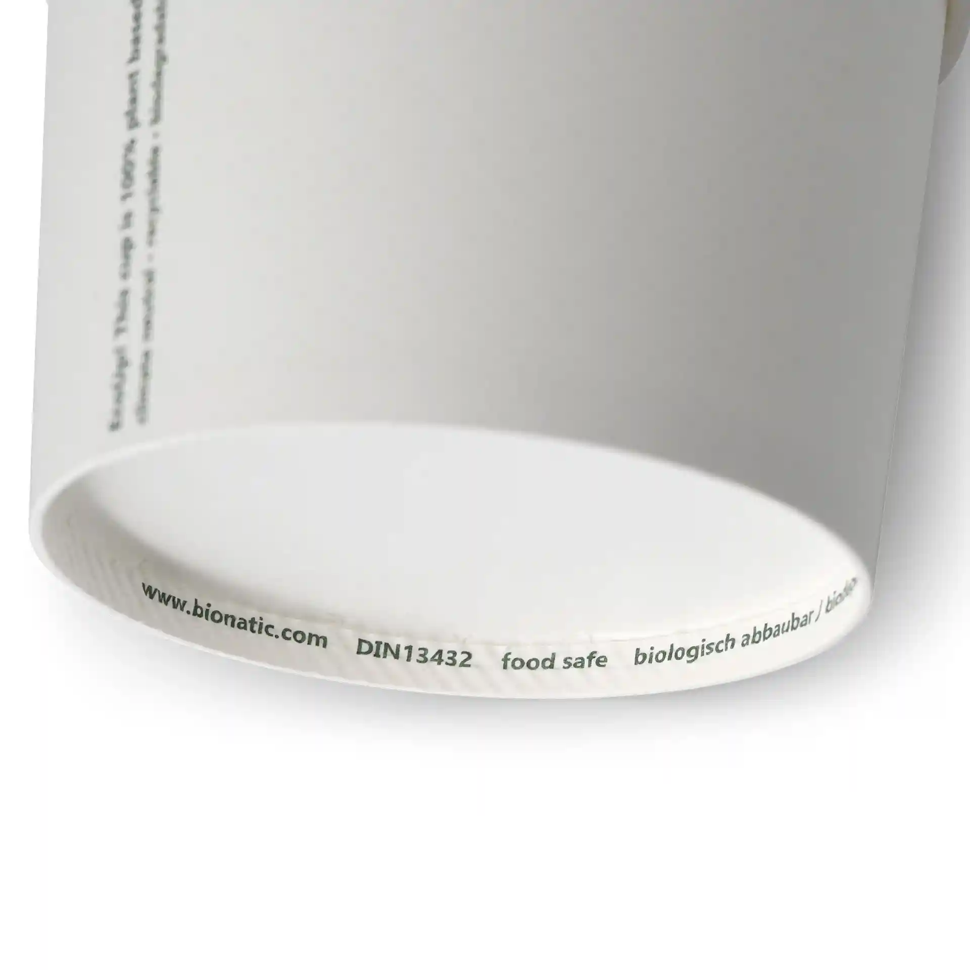 Coppetta per zuppa in cartone bianco di forma rotonda, mostra il bordo inferiore e le marcature stampate.