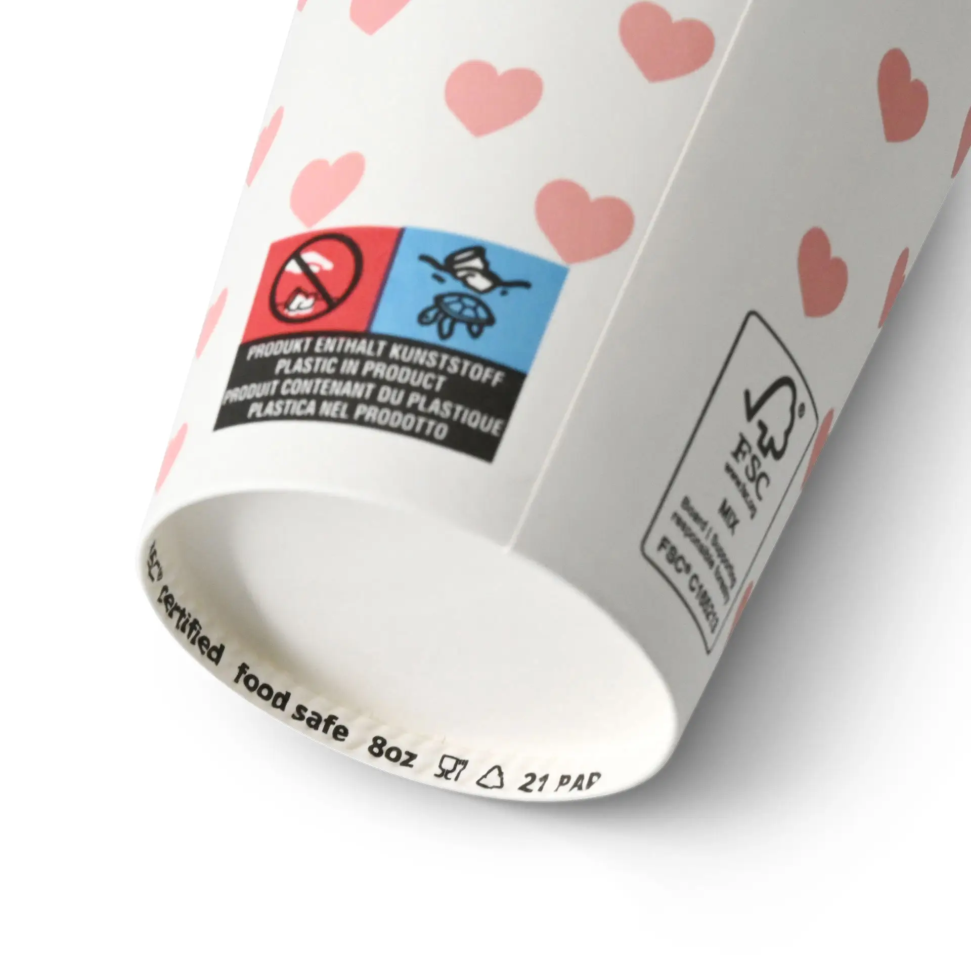 Un bicchiere di carta bianco con cuori rosa, contrassegnato come sicuro per alimenti e con vari etichette sul fondo.